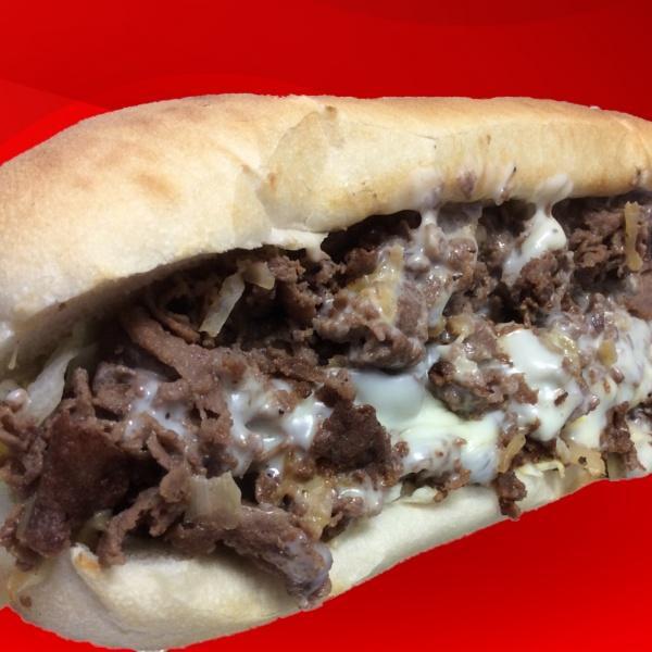 Philly Steak and Cheese Sub · Tender rib-eye steak, grilled onions and white American cheese.