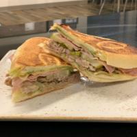 Cuban Sandwich · pulled pork, ham, melted swiss, house made mojo, pickles