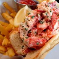 Lobster Roll · Cooked lobster meat with mayo, lemon, aioli, celery in a bun 