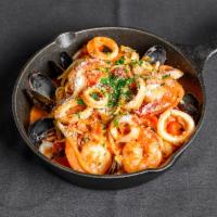Seafood Pasta · Sauteed wild shrimp, calamari, mussels, herbed tomato and light cream sauce.