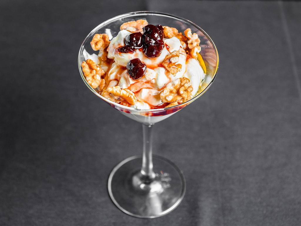 Greek Yogurt · Candied sour cherries and Greek honey. 