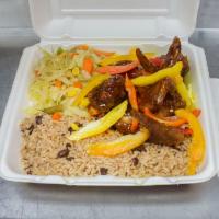 Jerk Chicken Wings · Served with 2 sides; rice and peas, white rice, cabbage or collard greens 