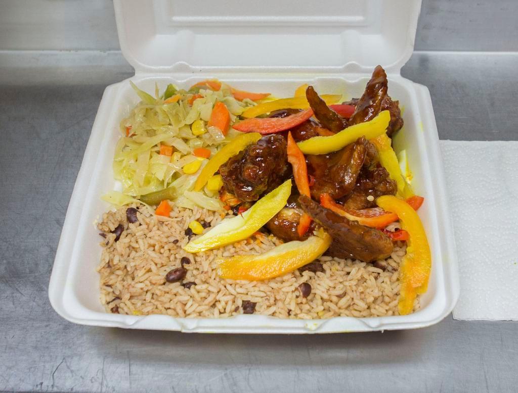 Jerk Chicken Wings · Served with 2 sides; rice and peas, white rice, cabbage or collard greens 