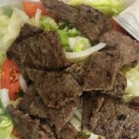 Gyro Salad · Tender Grilled Lamb over a Green Salad with our Homemade Gyro Sauce