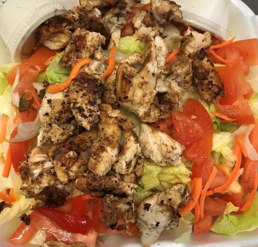 Grilled Chicken Salad · Marinated Chicken Tenderloins grilled to perfection over a Green Salad 