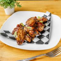 Volando Sentado · Chicken wings, chipotle guava and Zesty White. 