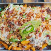 Loaded MamaFritas  · chipotle aoili, lime crema, creamy cheese sauce, crispy bacon, cojita cheese, guacamole, cho...