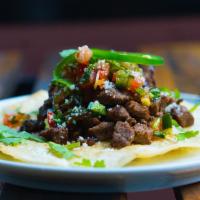 Al Asado  · Garlic cumin Marinated steak, Salsa asada, cojitia cheese, jalapeno 