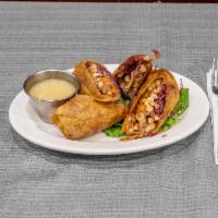 Sauerbraten Eggrolls · Our Traditional Dish re-styled, Served Inside of a Fried Shell.