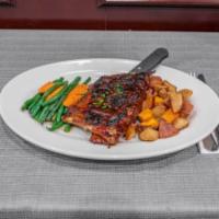 BBQ Pork Ribs Entree · Slow Cooked, Tender Ribs Dressed in our House BBQ Sauce. Comes with Two Sides. Add Pulled Po...
