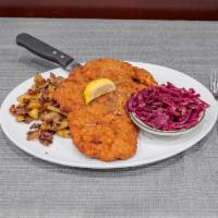 Wiener Schnitzel · Traditional Vienna-Style Breaded and Fried Pork Cutlet with Lemon Wedge on the Side. Served ...