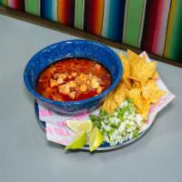 Pozole · Choice of verde with chicken or rojo with pork. Includes cilantro, onion, and lime chips.