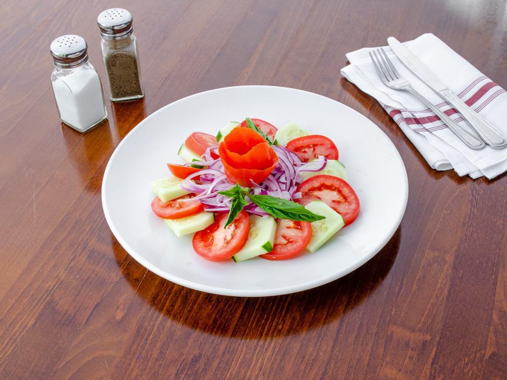 House Salad · Romaine, tomato, cucumbers, and Kalamata olives with balsamic vinaigrette.