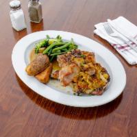 Premium Reserve Infused Pork Chops · Comes with hot cherry peppers. Includes home made potato croquette & vegetable