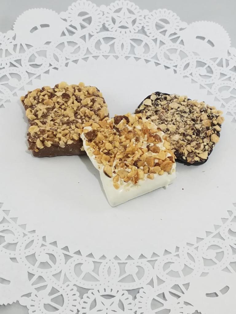 1/2 lb. English Toffee · Our best seller! You'd be amazed what butter, sugar, almonds and chocolate can do. Choice of Milk, white or dark chocolate.