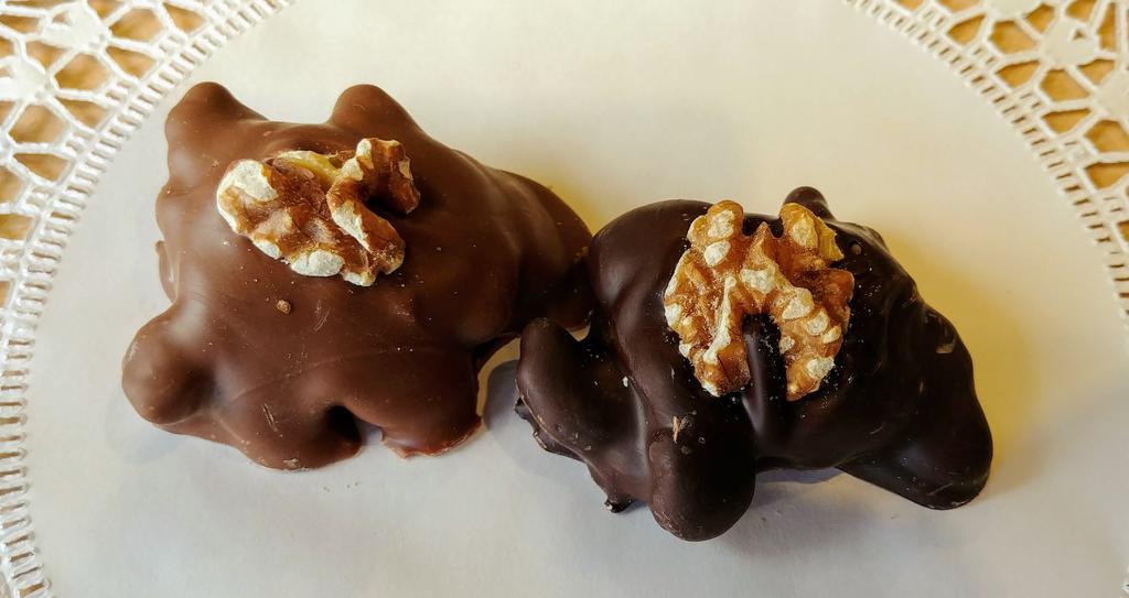 1/2 lb. Walnut Turtles · Nuts, Caramel & Chocolate. Approximately 6-10 pieces. Milk or dark chocolate.