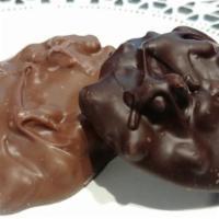 4 Walnut Clusters · Just nuts & chocolate. 4 pieces. Milk or dark chocolate.
