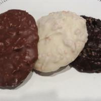 4 Toasted Coconut Clusters · Just toasted coconut & chocolate. 4 pieces. Milk, white or dark chocolate.