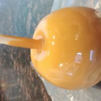 Plain Caramel Apple · Large Granny Smith Apple covered in our handmade caramel. Simple and classic!