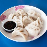 12. Pork Dumplings 水饺 · 8 pieces.