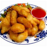 Sweet and Sour Chicken 甜酸鸡 · Served with rice and sweet and sour sauce on the side.