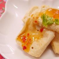 Sweet and Spicy Fried Bean Curd 甜辣炸豆腐 · Fried Bean Curd topped with Sweet and Spicy Sauce. With rice on side.