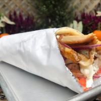 Something Greek Signature Sandwich · Chicken souvlaki topped with roasted red peppers, romaine lettuce, crumbled feta and signatu...