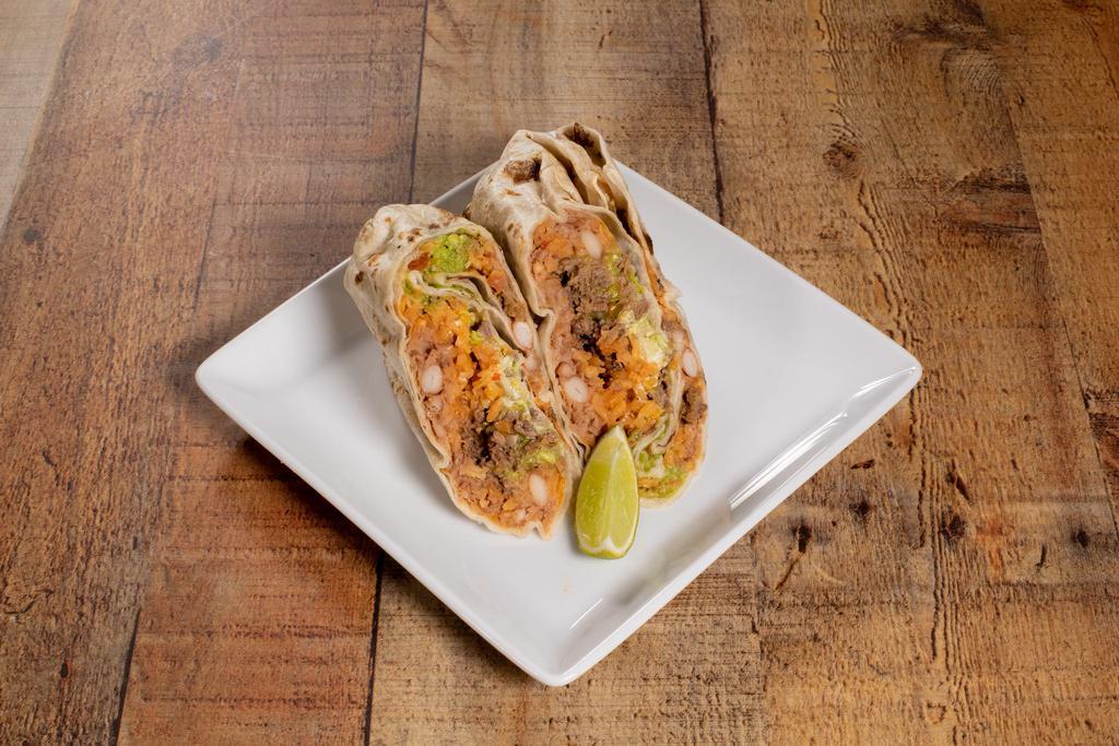 Grande Burrito · Flour tortilla stuffed with rice, beans, sour cream, guacamole, lettuce, jack cheese and roasted vegetable salsa. Vegetarian.