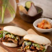 Bao Buns · Soft fluffy balls with your choice of protein, topped with cucumbers, cilantro, kimchi and p...
