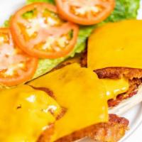 Chicken Cheddar · Breaded Chicken Cutlet with Melted Cheddar Cheese, Crispy Bacon, Lettuce & Tomato.