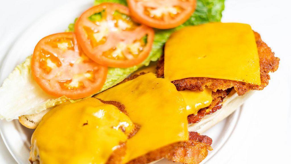 Chicken Cheddar · Breaded Chicken Cutlet with Melted Cheddar Cheese, Crispy Bacon, Lettuce & Tomato.