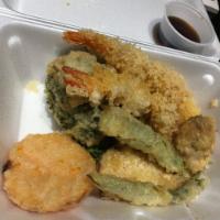 Shrimp Tempura · 2 piece shrimp tempura with fried vegetables tempuras. Tempura sauce on the side.