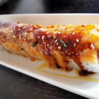 Bubblefish Roll · Spicy crab, cucumber and mango inside, topped with torched spicy salmon, rice masago, bonito...