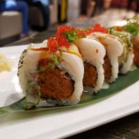 Marilyn Monroll · Spicy tuna, spicy salmon, avocado inside, topped with torched white tuna, masago and scallio...
