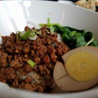 Taiwanese Minced Pork Over Rice · White rice topped with spinach, minced pork and a marinated egg