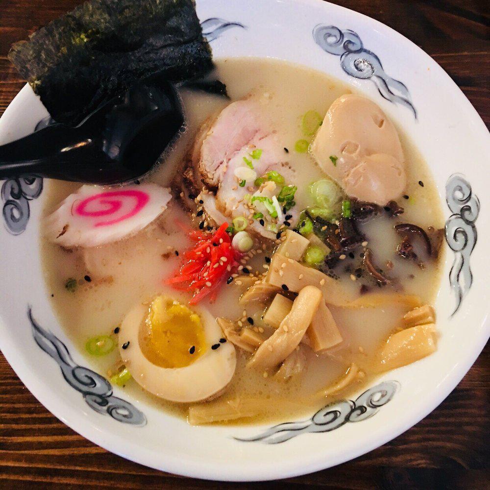 Tonkotsu Ramen · Noodle with chasu pork, mushroom ears, bamboo shoots, red pickled ginger, scallion, marinated egg and naruto fish cake. Pork bone broth on the side