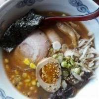 Shoyu Ramen · Noodles with chasu pork, corn, bamboo shoots, mushroom ears, scallion and marinated egg. Por...