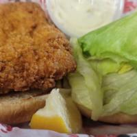 Fish Filet Sandwich · Freshly breaded and golden fried served with lettuce, tomato, tartar sauce, and a lemon wedg...