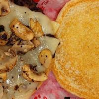 Triple Mushroom Swiss Burger · Topped with grilled mushrooms and Swiss cheese