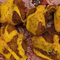 9 Spicy Cheese Nuggets · Fresh, all-white meat chicken, hand-breaded on-premises topped with whiz and Pistol Pete spi...
