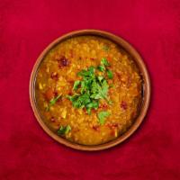 Central Dal Tadka · Yellow lentil cooked in high flame with Indian spices and ingredients with the touch of butt...