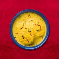 Imperial Rasmalai · Soft cheese patties soaked in milk, cardamom and rose water syrup.