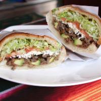 Steak Torta · Served with mayo, fried beans, lettuce, tomato, avocado, oaxaca cheese, red onion and jalape...