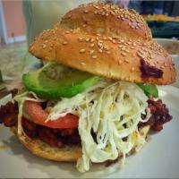 Breaded Chicken Cemita · Avocado, Lettuce, Tomato, mayo, Refried beans, Oaxaca cheese, red onions, and chipotle.