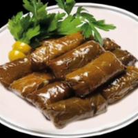 DOLMA (8 pieces) · Grape leaves stuffed with rice, Mediterranean spices and lemon juice.
Comes with tzatziki sa...