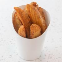 Potato Wedges · Potato wedges seasoned with our special blend of herbs and spices.