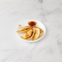 34. Dumplings · 8 pieces. Served with a choice of protein and a choice of preparation.
