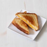 Grilled Cheese Sandwich · Add bacon or ham and tomato for an additional charge.