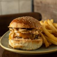 W&W Burger · Half-pound beef burger, cheddar, crispy onions, signature sauce 