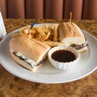 Classic French Dip Sandwich · 1/2 lb. tender eye of the round pilled high with cheese. Au jus on the side.